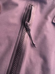 Pockets with water resistant zippers